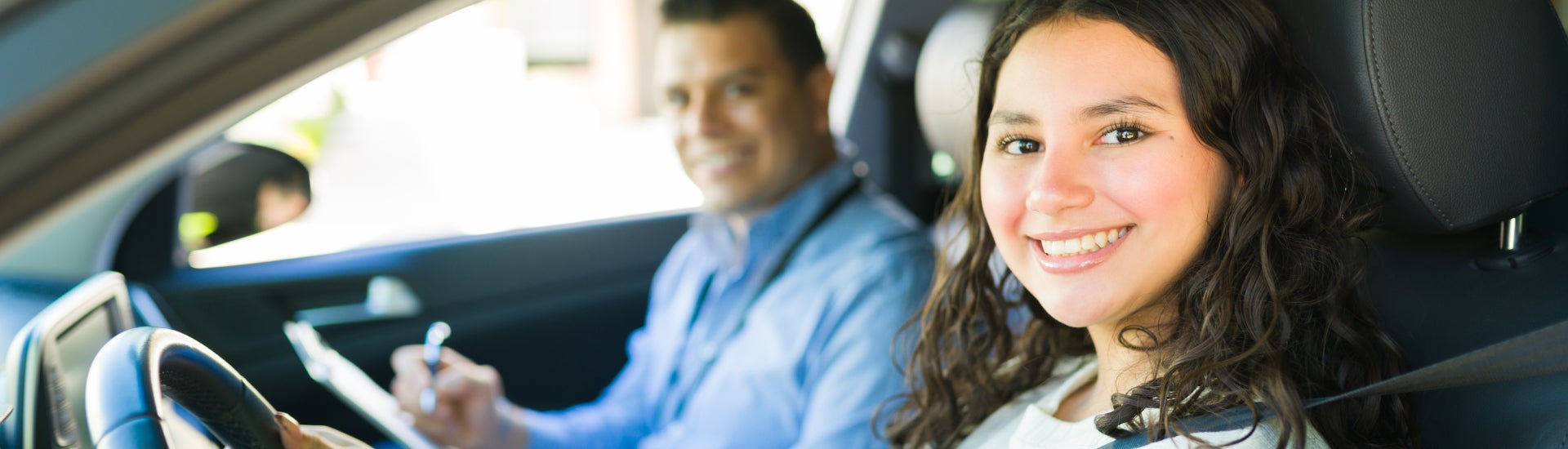First Time Buyers driving off in their new vehicle